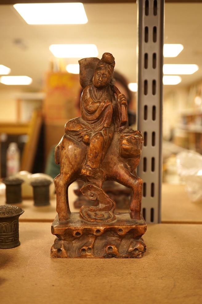 Chinese items comprising a soapstone carving, three jade carvings, one with gilt metal pendant mounts and two brass knops